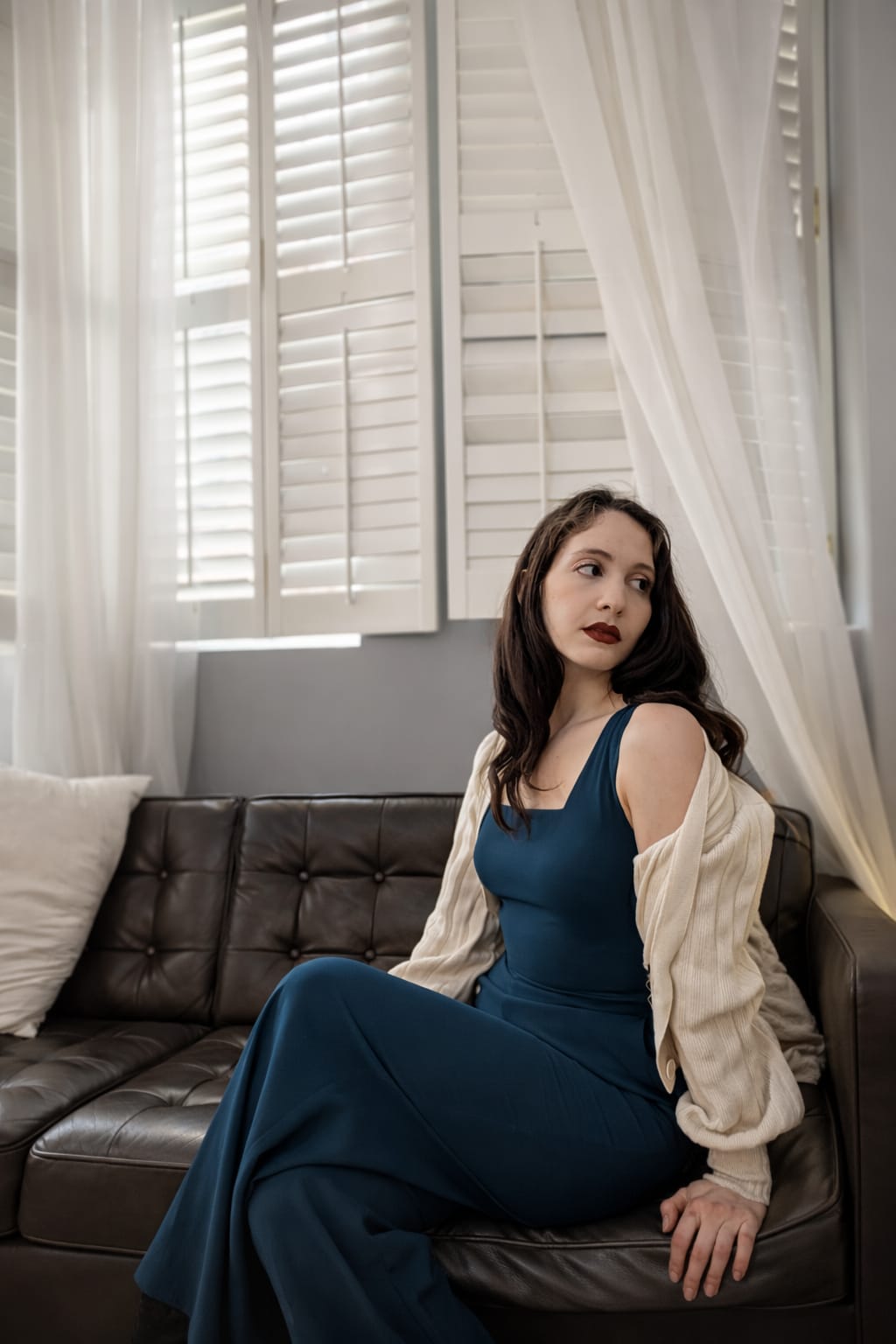 Editorial — teal dress, seated